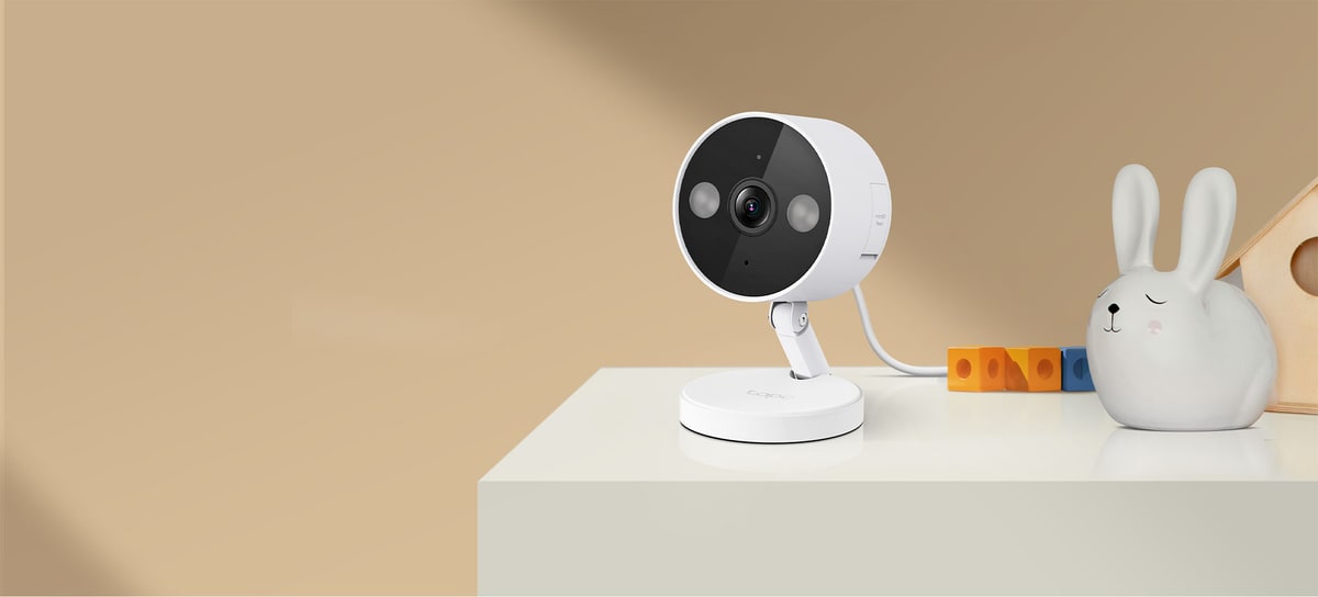 Tapo C120 indoor outdoor security camera shown in an indoor lifestyle setting